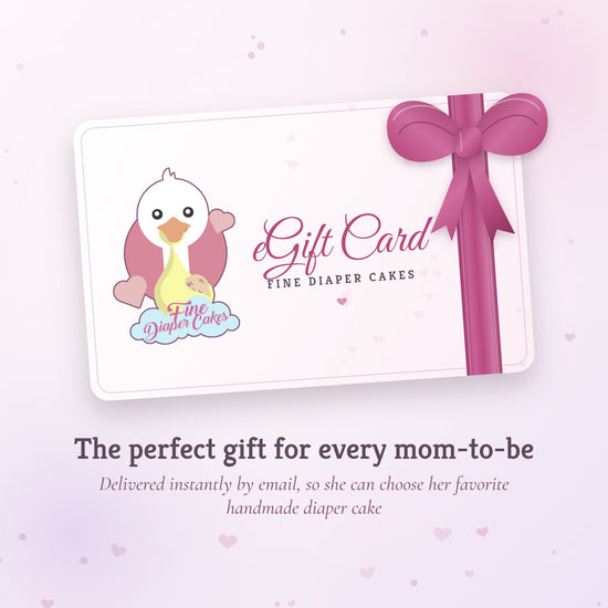 Fine Diaper Cakes eGift Card with a pink satin bow, the perfect gift for every mom-to-be