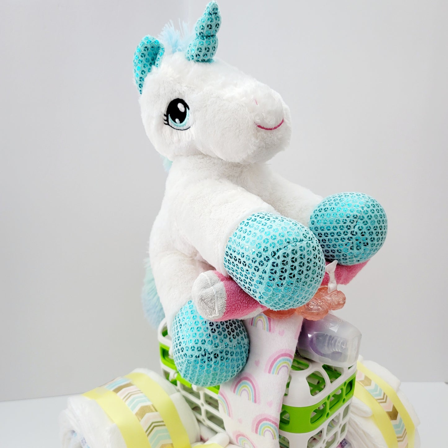 Unicorn Baby on a Quad Bay Shower Diaper Cake Creation