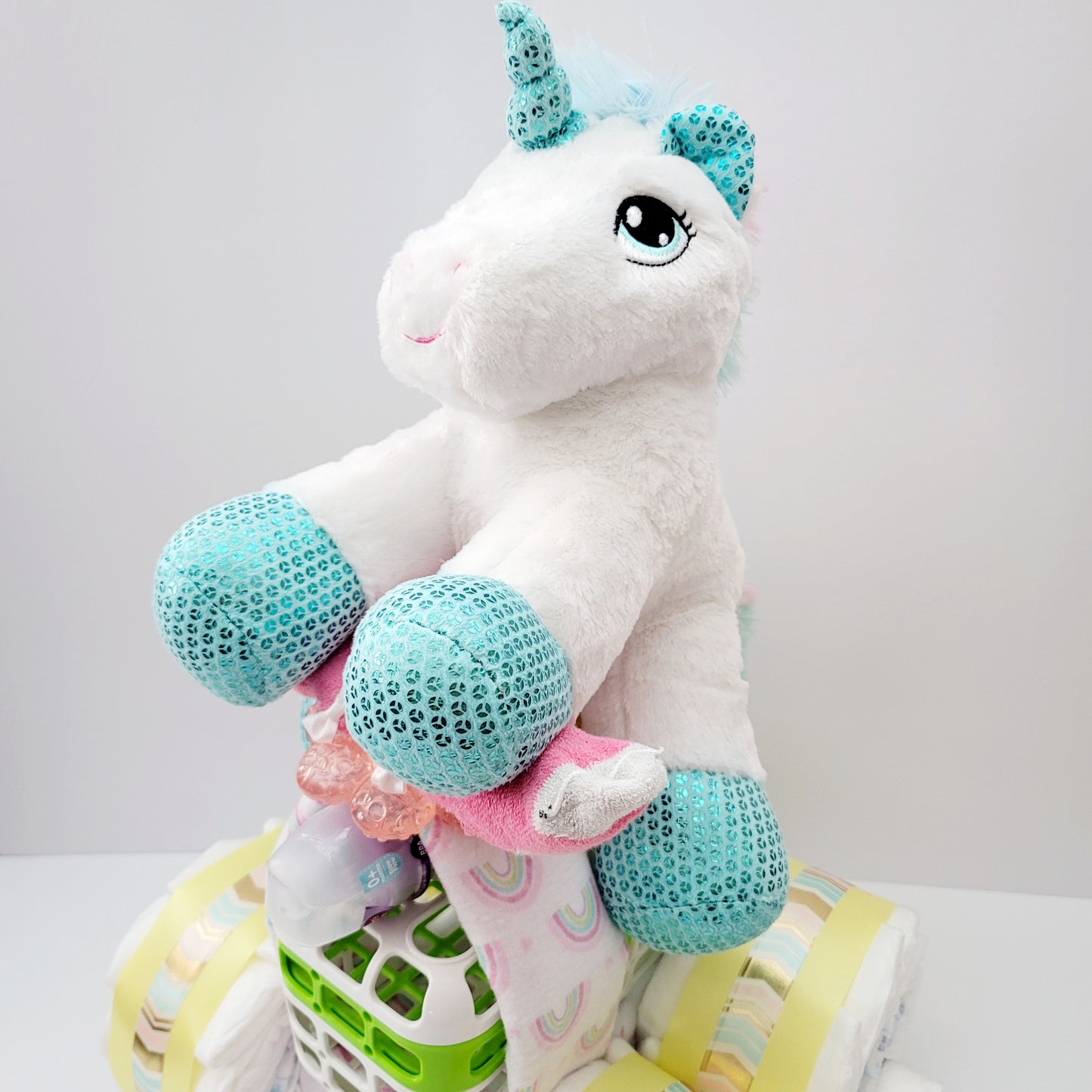 Unicorn Baby on a Quad Bay Shower Diaper Cake Creation